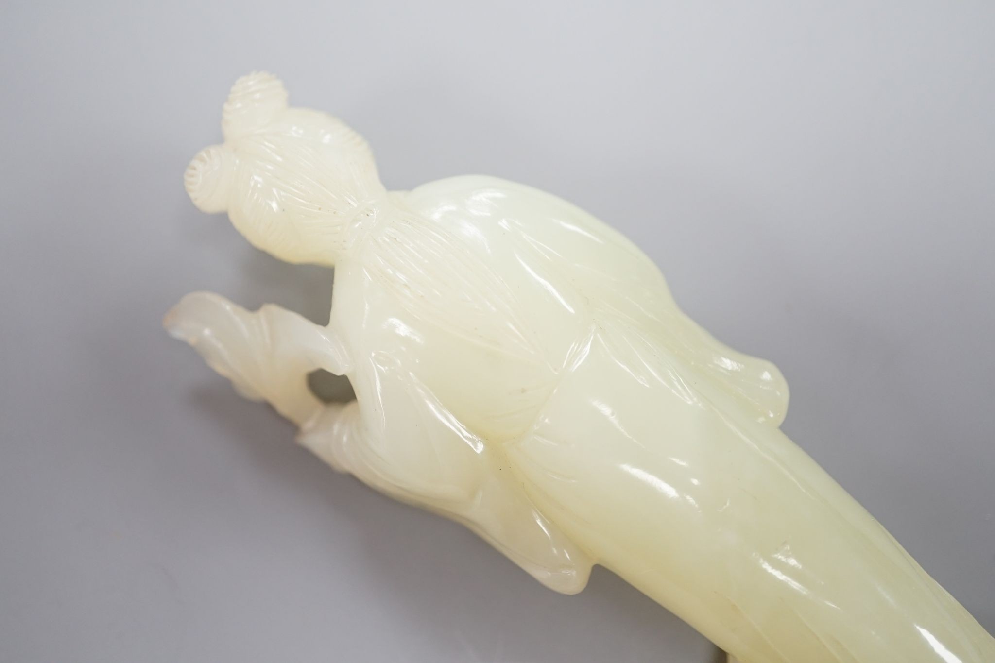 A Chinese bowenite carving of a lady, 12 cms high.